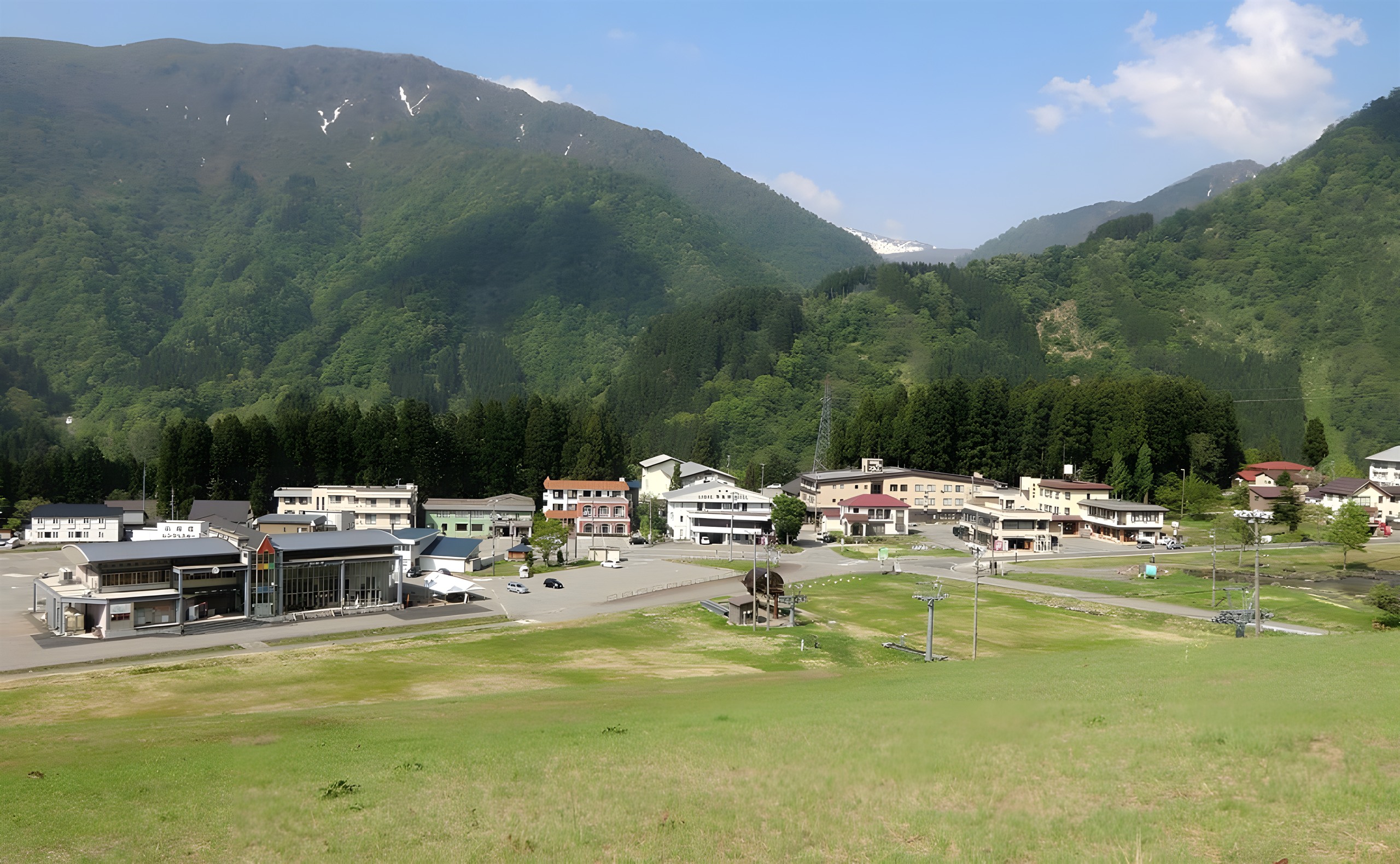 Ichirino village nestled in deep green forested mountains in the summer season.